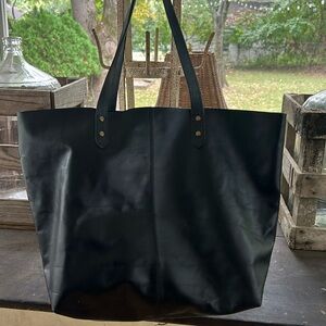 Unstructured black leather tote by Denè